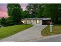 Well-kept home on a sloping lot, featuring a long driveway and carport at 2804 Hall Se Dr, Smyrna, GA 30082