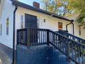 Inviting entrance with well-maintained steps, railing, and decorative door enhancing curb appeal at 1384 Allegheny Sw St, Atlanta, GA 30310