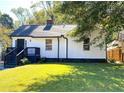 Charming home featuring a well-maintained lawn, classic curb appeal, and inviting front entry at 1384 Allegheny Sw St, Atlanta, GA 30310