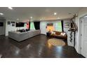 Spacious living room featuring hardwood floors, sectional sofa and abundant natural light at 2874 Cloverleaf Se Dr, Atlanta, GA 30316