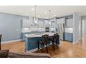 Spacious kitchen features stainless steel appliances, a large island, and hardwood floors at 123 Academy Ln, Canton, GA 30114