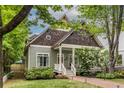 Inviting craftsman-style home featuring a covered front porch and landscaped yard at 655 Moreland Se Ave, Atlanta, GA 30316