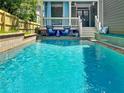 Relaxing backyard pool area with a charming porch, perfect for summer days at 655 Moreland Se Ave, Atlanta, GA 30316