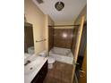 Bathroom with a tile shower, soaking tub, toilet, and vanity with sink at 898 Oak St # 3412, Atlanta, GA 30310