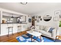 Bright living room with stylish decor, hardwood floors, and open access to the kitchen at 24 Daniel Se St # 3, Atlanta, GA 30312