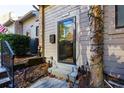 Home's entrance featuring a storm door, mailbox, and exterior lighting leading to the front door at 3812 Stonewall Se Ter, Atlanta, GA 30339