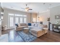 Bright living room featuring a large sectional sofa and elegant blue patterned rug at 1382 Doublegate Ne Dr, Atlanta, GA 30319