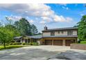 Beautiful brick home with an attached three-car garage, a spacious driveway, and well-maintained greenery at 204 Mt Moriah Rd, Auburn, GA 30011
