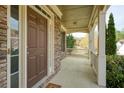 Inviting front porch with stone accents and a cozy, covered entryway at 300 Maple Grove Ct, Canton, GA 30114