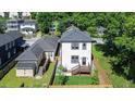 An aerial view of a home and backyard featuring a new deck and well-kept lawn at 1166 Mcdaniel Sw St, Atlanta, GA 30310