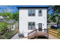 Rear exterior view of a home with a deck, yard, and modern siding at 1166 Mcdaniel Sw St, Atlanta, GA 30310