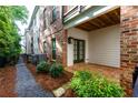 Private backyard brick patio with access to walking path and community space at 451 Burton Dr # 32, Alpharetta, GA 30009