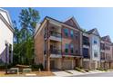 Handsome brick townhome featuring two balconies and attached two-car garage at 451 Burton Dr # 32, Alpharetta, GA 30009