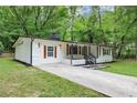 Attractive single-story home with a well-maintained lawn and a covered front porch at 3458 Cooper St, Lithia Springs, GA 30122