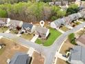 Overhead view of the home showcasing the property's landscaping and location on a corner lot at 2710 Irwin Ct, Cumming, GA 30041