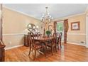 Formal dining room featuring hardwood floors, a chandelier, and traditional furnishings at 1405 Murdock Rd, Marietta, GA 30062