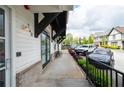 Exterior shot showcasing a sidewalk lined with shrubbery, providing sidewalk access at 160 Fowler St # 100, Woodstock, GA 30188