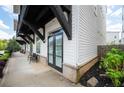 Inviting ground-floor patio with outdoor seating, perfect for relaxing outside at 160 Fowler St # 100, Woodstock, GA 30188