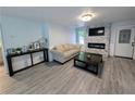 Modern living room with a fireplace, stylish decor, and ample natural light at 1939 Suwanee Valley Rd, Lawrenceville, GA 30043