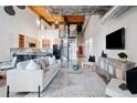 Bright living room featuring an open floor plan, modern decor, and spiral staircase to the upper level at 170 Boulevard Se # E414, Atlanta, GA 30312
