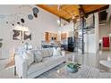 Spacious living room with high ceilings, open layout, modern kitchen, and spiral staircase at 170 Boulevard Se # E414, Atlanta, GA 30312