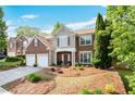 Beautiful two-story home with brick accents, a well-kept lawn, and a two-car garage at 238 Diamond Valley Pass, Canton, GA 30114
