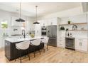 Modern kitchen with stainless steel appliances, a large island, and open shelving at 156 Martha Ne Ave, Atlanta, GA 30317
