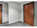 Condo hallway with apartment number and wood apartment door at 361 17Th Nw St # 1222, Atlanta, GA 30363