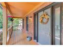 Close-up of the front door with a decorative wreath, sidelights, and a covered porch at 2981 Cardinal Lake Dr, Duluth, GA 30096