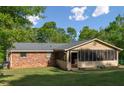 Home featuring an inviting sunroom with a screened-in porch, perfect for enjoying the outdoors from inside at 3833 Coral Ln, Douglasville, GA 30135
