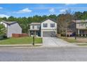 Charming two-story home featuring a covered front porch and a spacious two-car garage at 820 Lake Chase, Fairburn, GA 30213