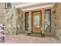 Brick entryway with stone accents and a decorative front door at 3493 Wood Acres Blvd, Duluth, GA 30096