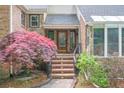 Entrance with stairs, iron railing, and beautiful Japanese Maple tree at 3493 Wood Acres Blvd, Duluth, GA 30096
