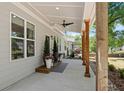 Covered front porch featuring wood columns, recessed lighting, potted plants, and a ceiling fan at 2553 Creekwood Ter, Decatur, GA 30030