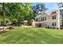 Beautifully landscaped front yard with lush green lawn surrounding a modern, two-story home at 2553 Creekwood Ter, Decatur, GA 30030