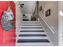 Inviting foyer with a bright red door, and stairs leading to the upper level at 1189 Norfolk Nw Dr, Acworth, GA 30102