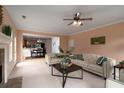 Open-concept living room flowing into dining area; perfect for entertaining guests at 60 Heritage Keep, Covington, GA 30016