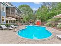 Inviting backyard with a private pool, screened porch, and ample space for outdoor relaxation and entertainment at 1985 Chapel Estates Ln, Dacula, GA 30019