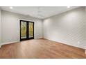 Spacious bedroom with hardwood floors and private balcony access at 2329 Mason Dr # D24, Atlanta, GA 30316