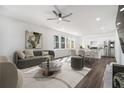 Open concept living room with modern decor and updated kitchen with stainless steel appliances at 102 Dahlia Sw Ave, Atlanta, GA 30314
