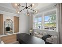 Bright office features modern lighting, a built-in mirror, and a cozy window bench for a peaceful workspace at 126 Kenney Way, Locust Grove, GA 30248