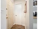 Clean entryway featuring tile flooring and a coat closet for added convenience at 446 Teal Ct, Roswell, GA 30076