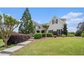 Picture of a beautiful home exterior with green grass and manicured bushes at 639 Puckett Se Rd, Emerson, GA 30137