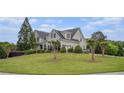 Beautiful home with a large front lawn and mature trees at 639 Puckett Se Rd, Emerson, GA 30137