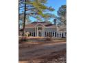 Beautiful traditional home with prominent columns, arched windows, and well-manicured landscaping at 370 Buchanan Circle Tract 1, Dallas, GA 30157