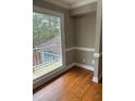 Bright room with large windows overlooking the greenery and a private deck, and hardwood floors at 370 Buchanan Circle Tract 1, Dallas, GA 30157