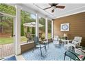 Inviting screened porch with stylish furnishings, offering a relaxing outdoor living space with beautiful views at 155 Point View Dr, Canton, GA 30114