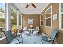 A cozy screened porch with comfortable seating, creating a perfect spot for relaxation and enjoying the outdoors at 155 Point View Dr, Canton, GA 30114