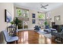 Bright living room featuring hardwood floors, a fireplace, and large windows at 1440 Hillpine Ln, Atlanta, GA 30306