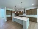 Spacious kitchen with an island, stainless steel appliances, and ample cabinet space at 1994 Freestone Way, Marietta, GA 30064